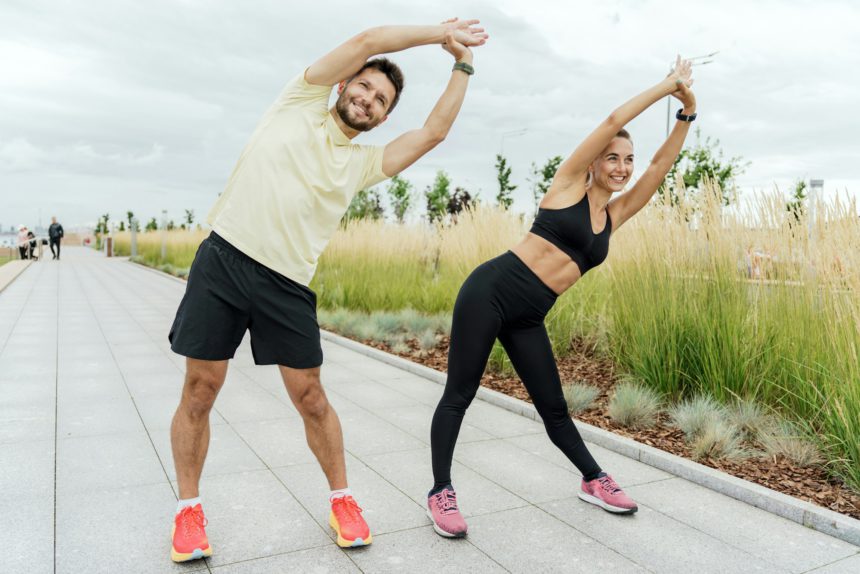 A man and a woman training together. Friends outdoor exercise physical activity for the body