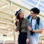 Asian couple make eye contact, show love and happiness in honeymoon trip in Thailand